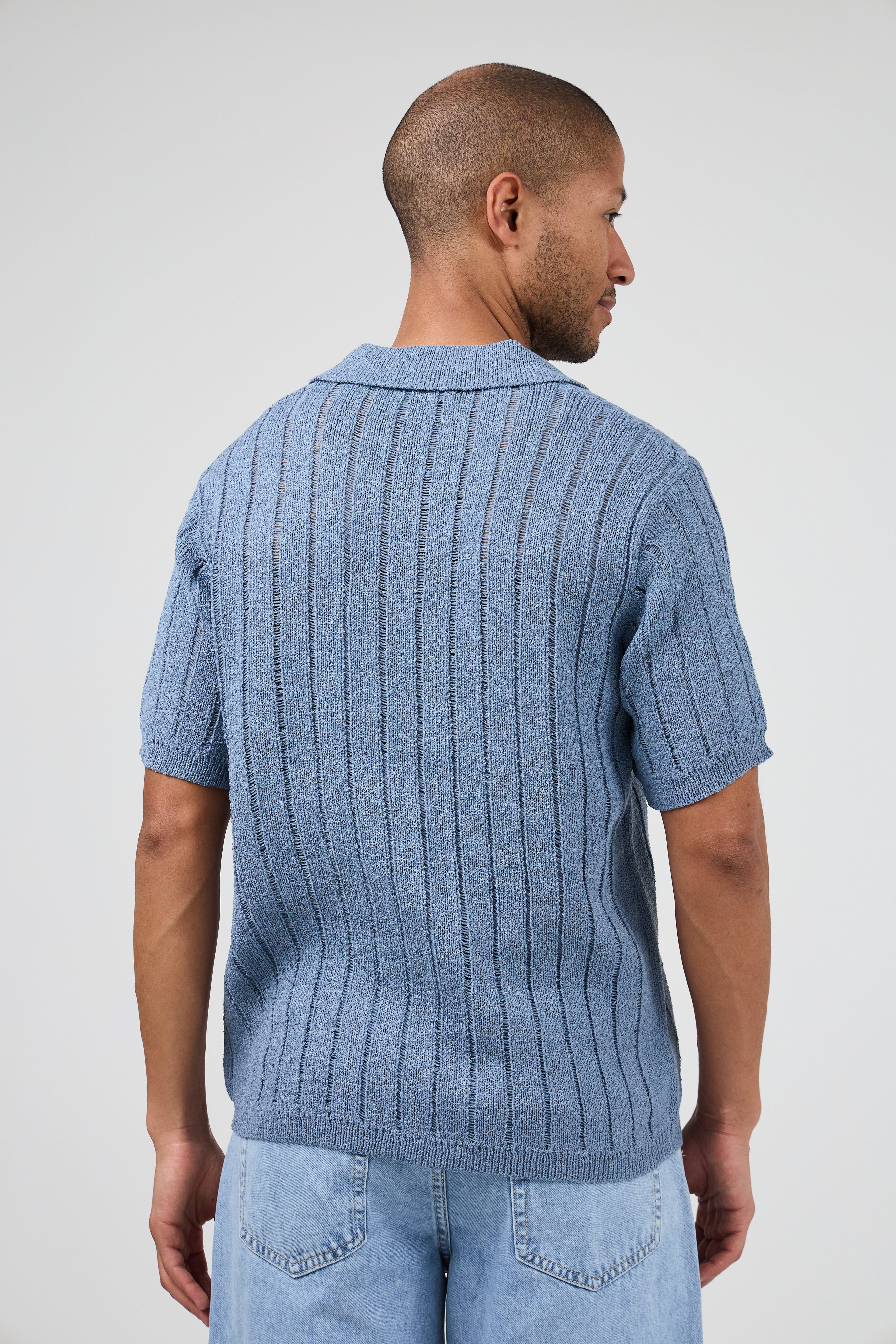 Polo en maille ajourée à manches courtes