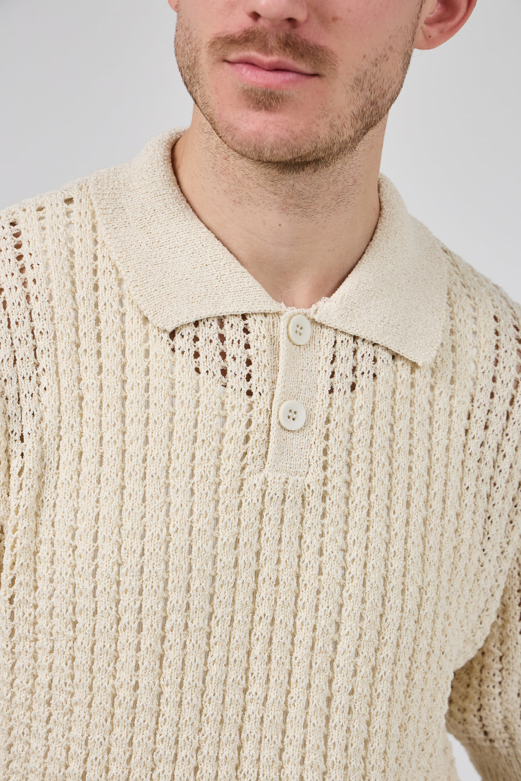 Polo en maille ajourée texturée