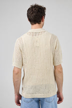 Polo en maille ajourée texturée