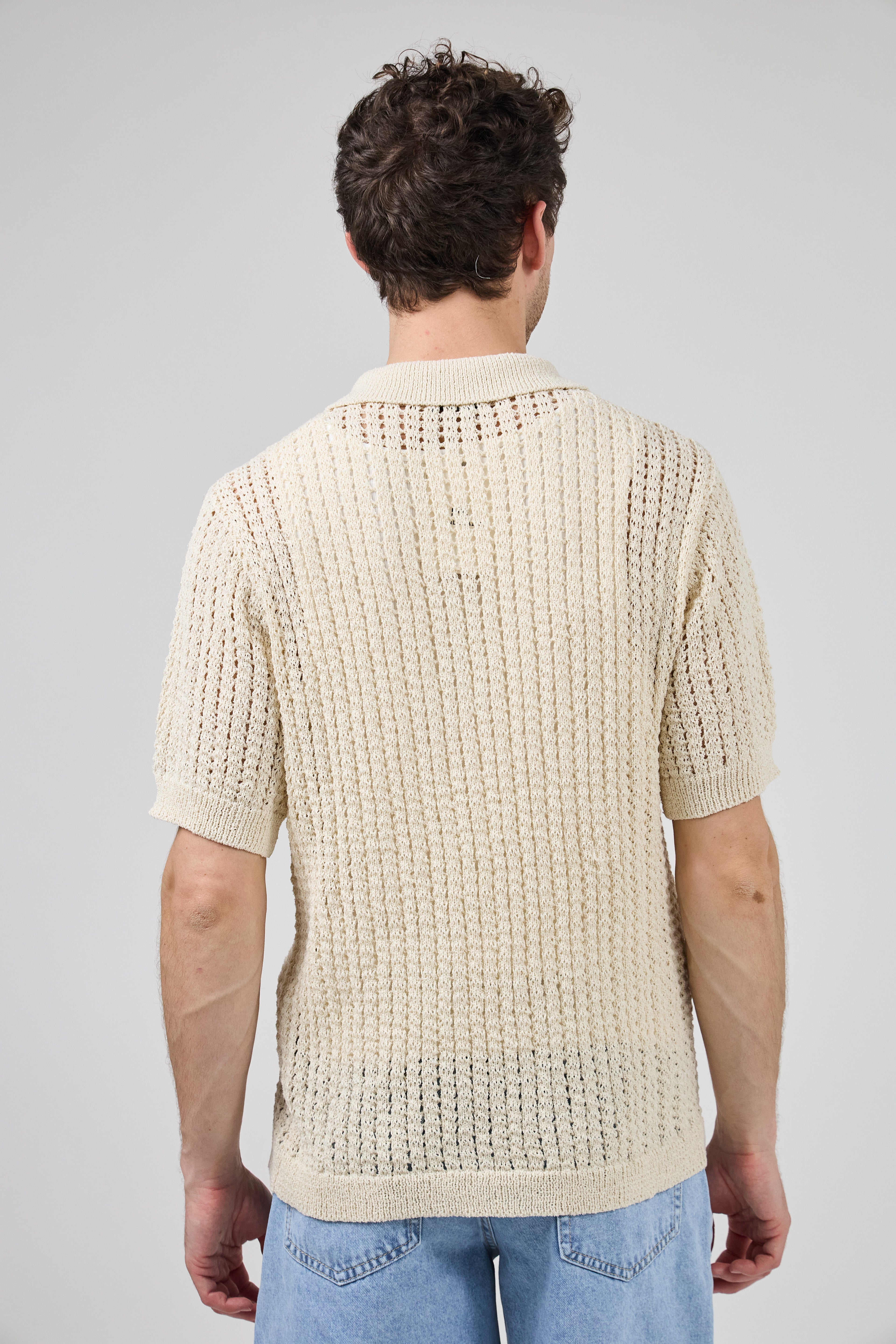Polo en maille ajourée texturée