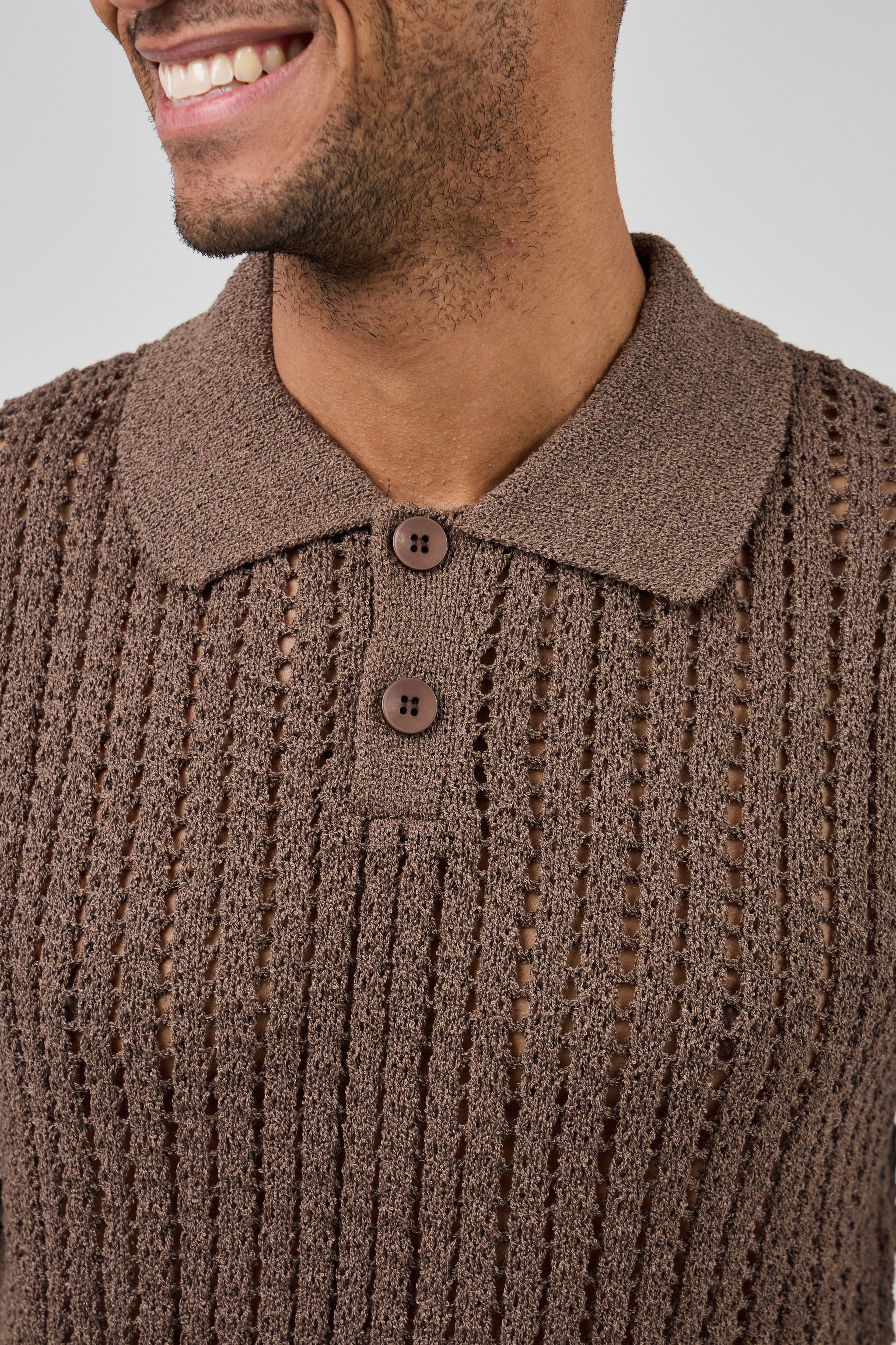 Polo en maille ajourée texturée