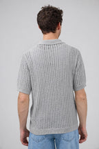 Polo en maille ajourée texturée