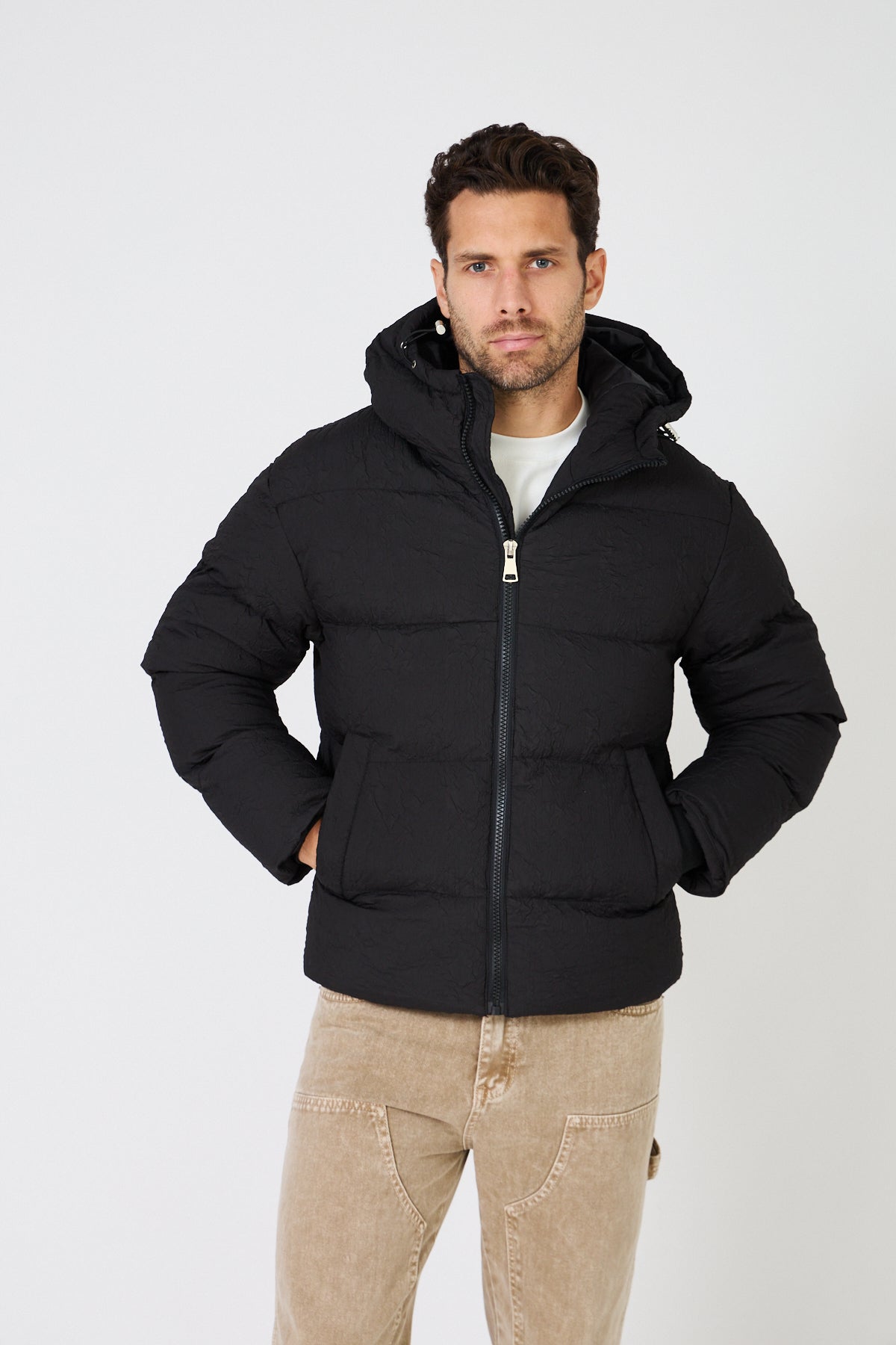 Men's light-colored quilted down jacket with hood