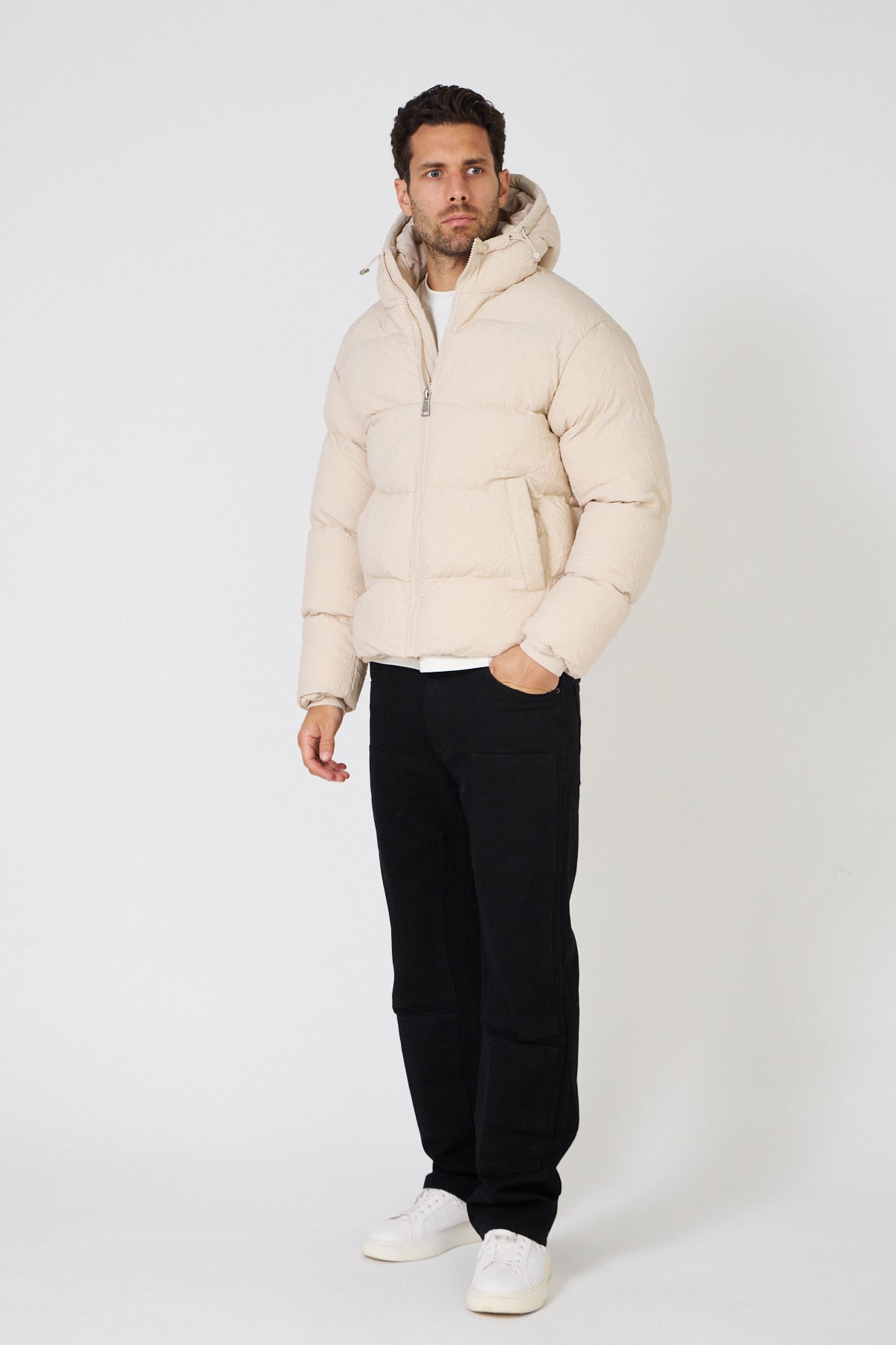 Men's light-colored quilted down jacket with hood