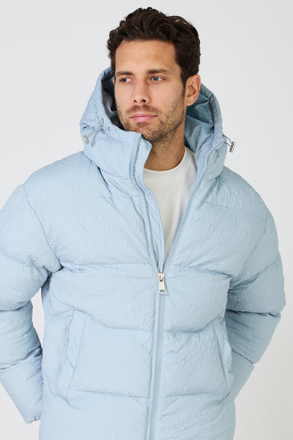 Men's light-colored quilted down jacket with hood