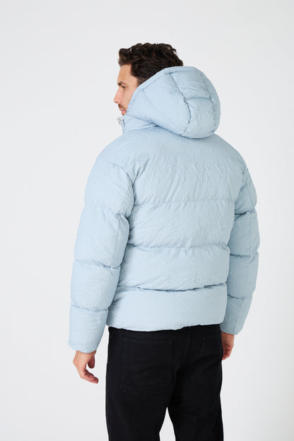 Men's light-colored quilted down jacket with hood