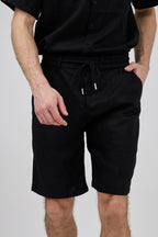 Short homme à taille élastique en lin avec cordon de serrage