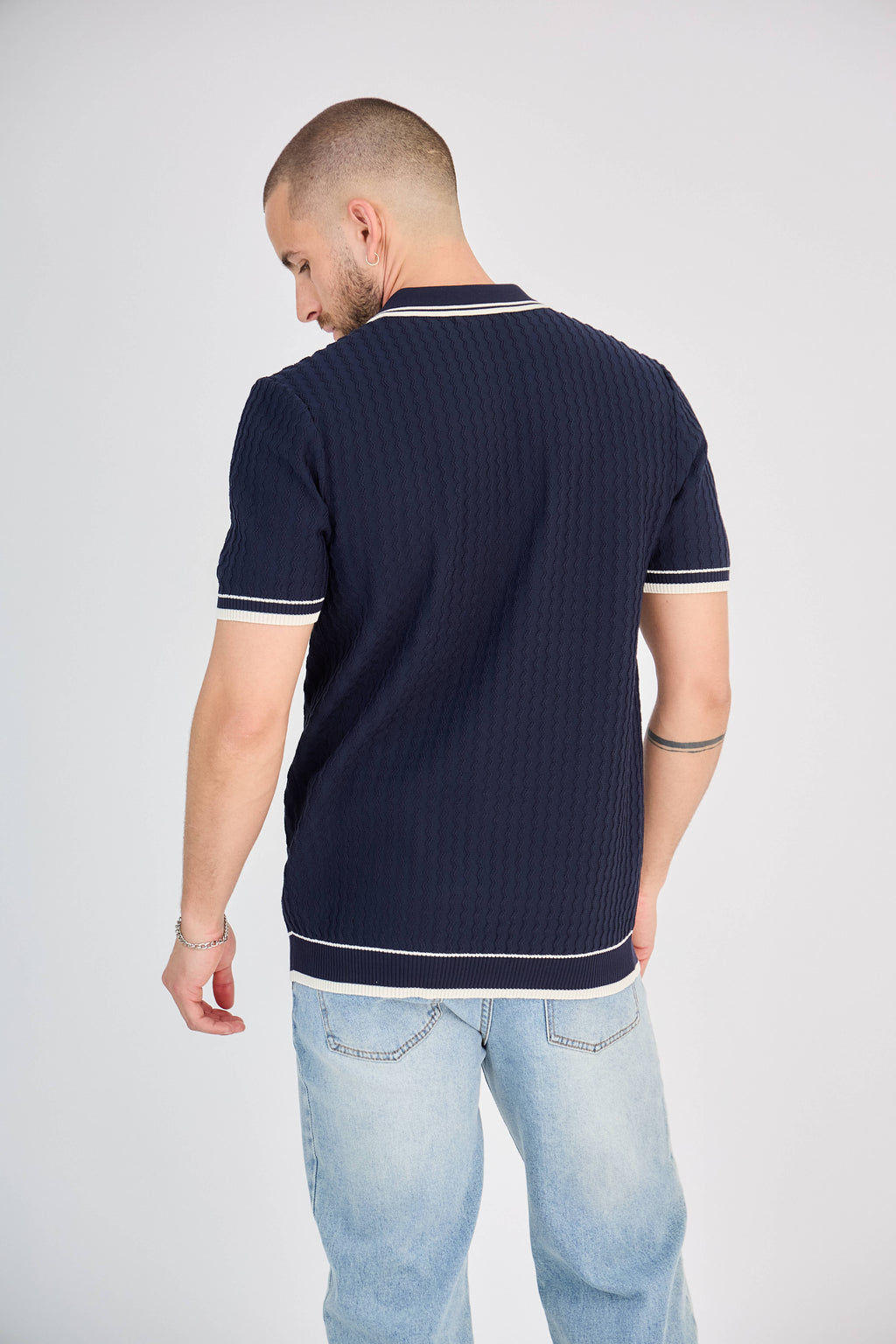 Polo zippé en maille torsadée marine