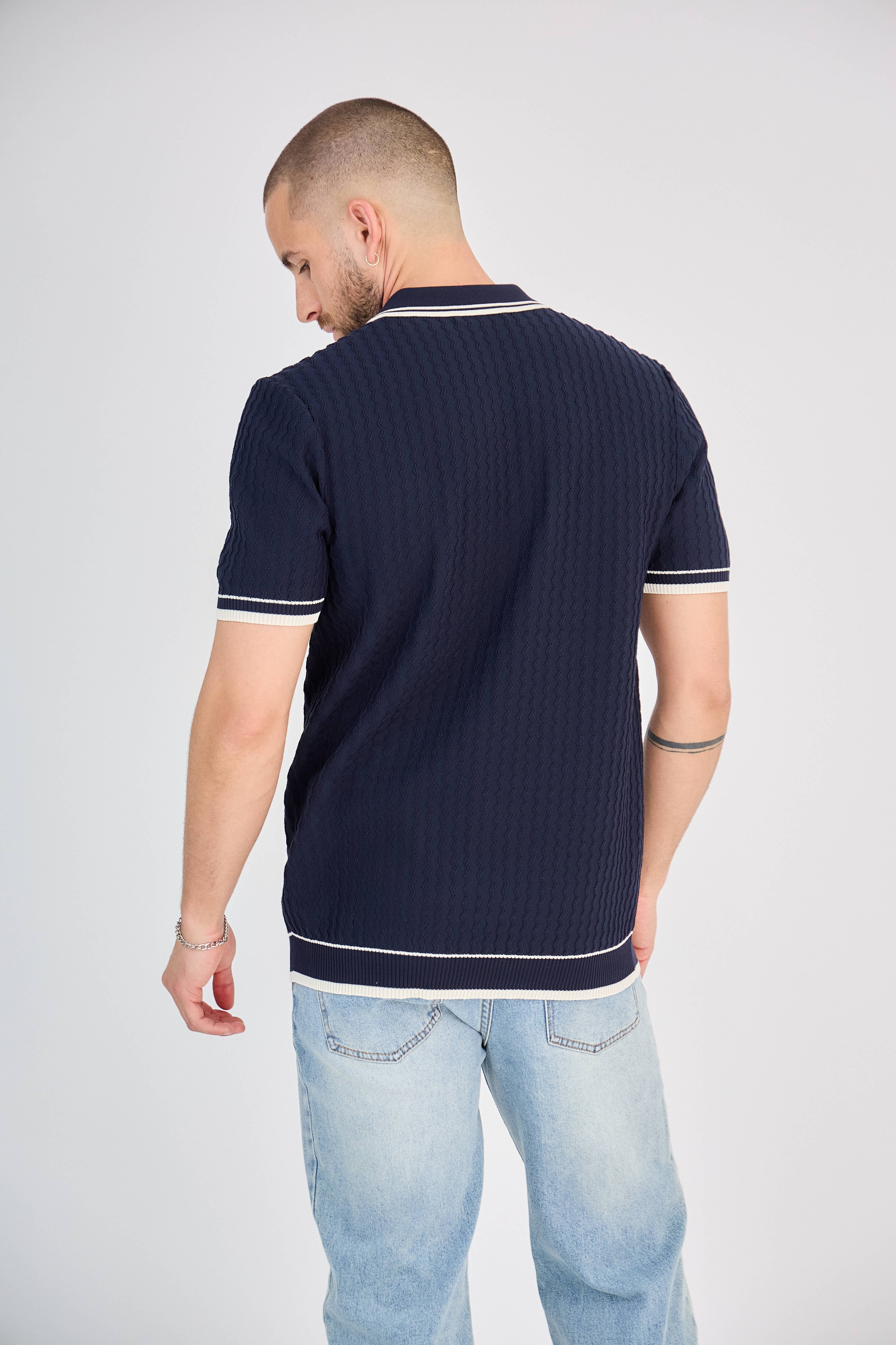 Polo zippé en maille torsadée marine